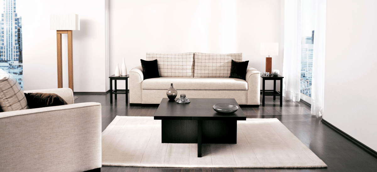 A clean and uncluttered living room with nice furniture, staged for a home sale