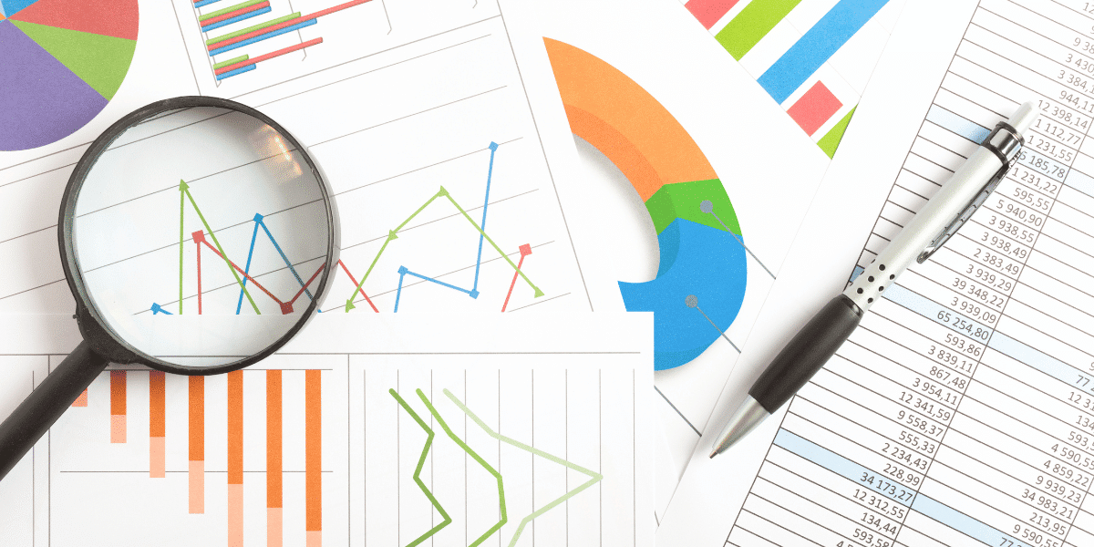 A desk filled with graphs representing data analytics