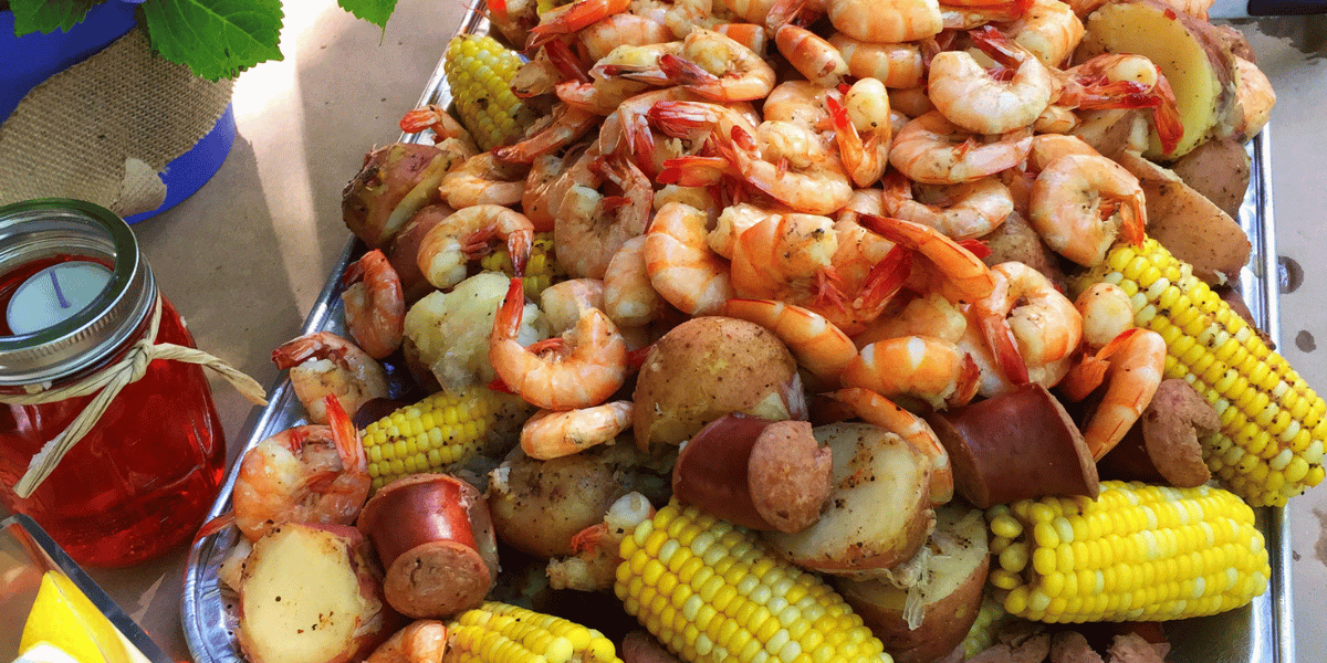 A tray filled with seafood, known as a Low Country Boil